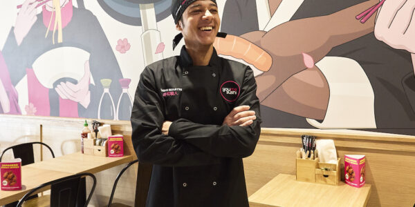 Sushi chef laughing while in a YouMeSushi restaurant