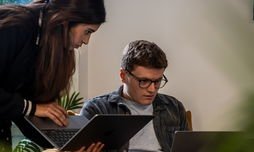 two support agents helping a QSR business online