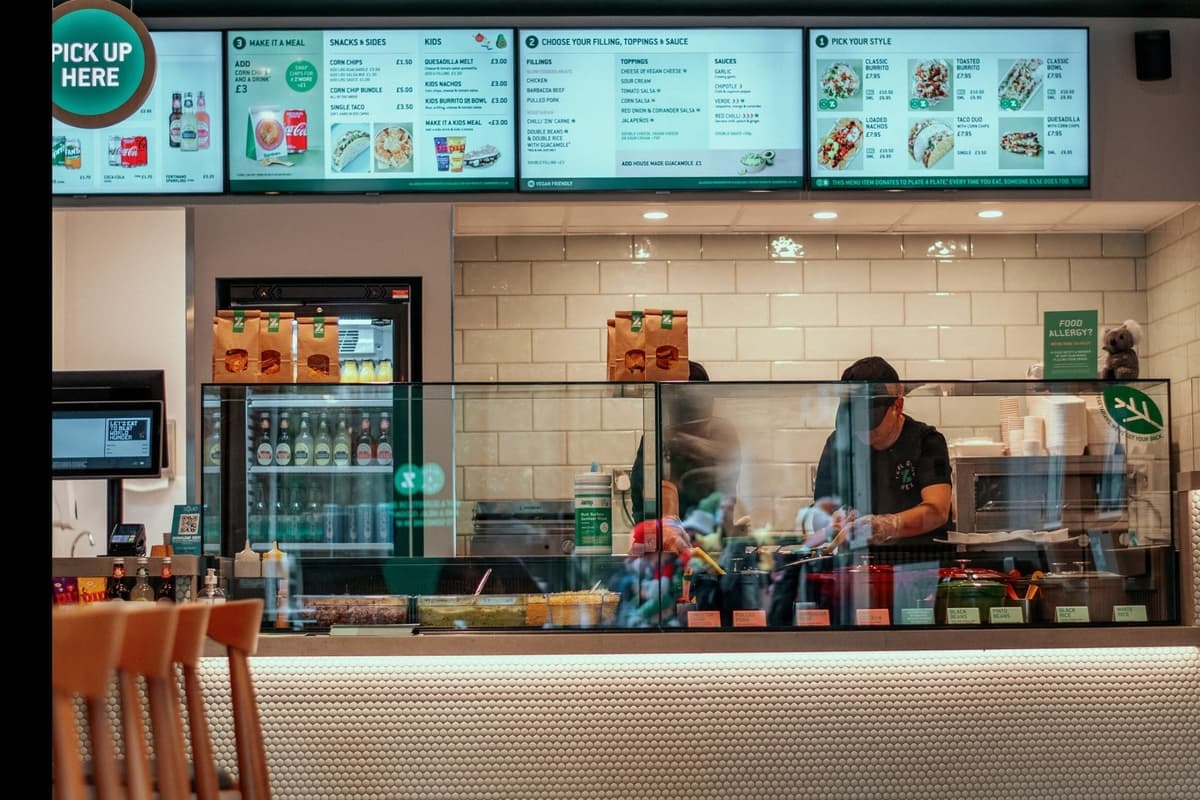 Zambrero employee working behind the counter